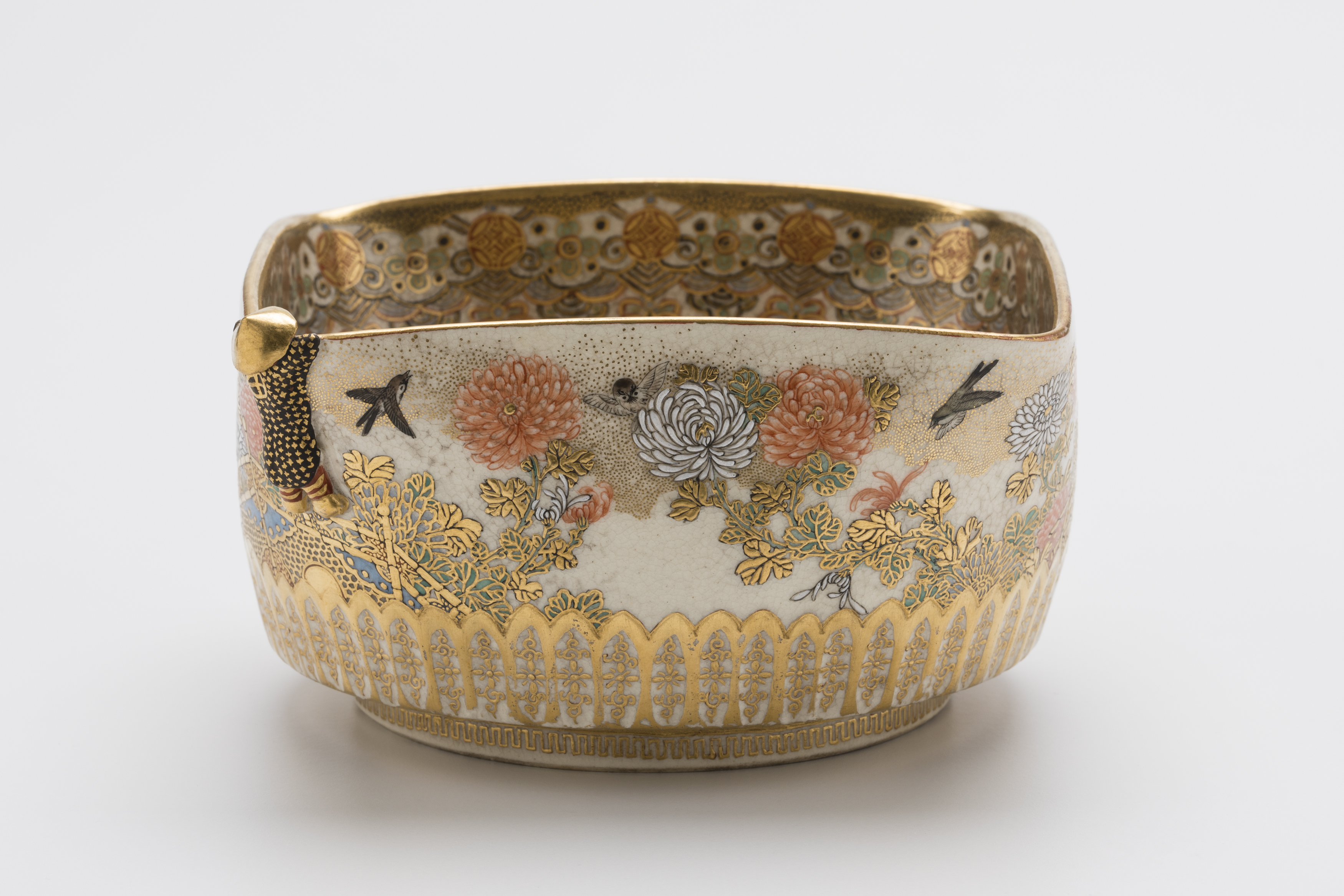 Single object image of a square shape bowl with gold decoration.